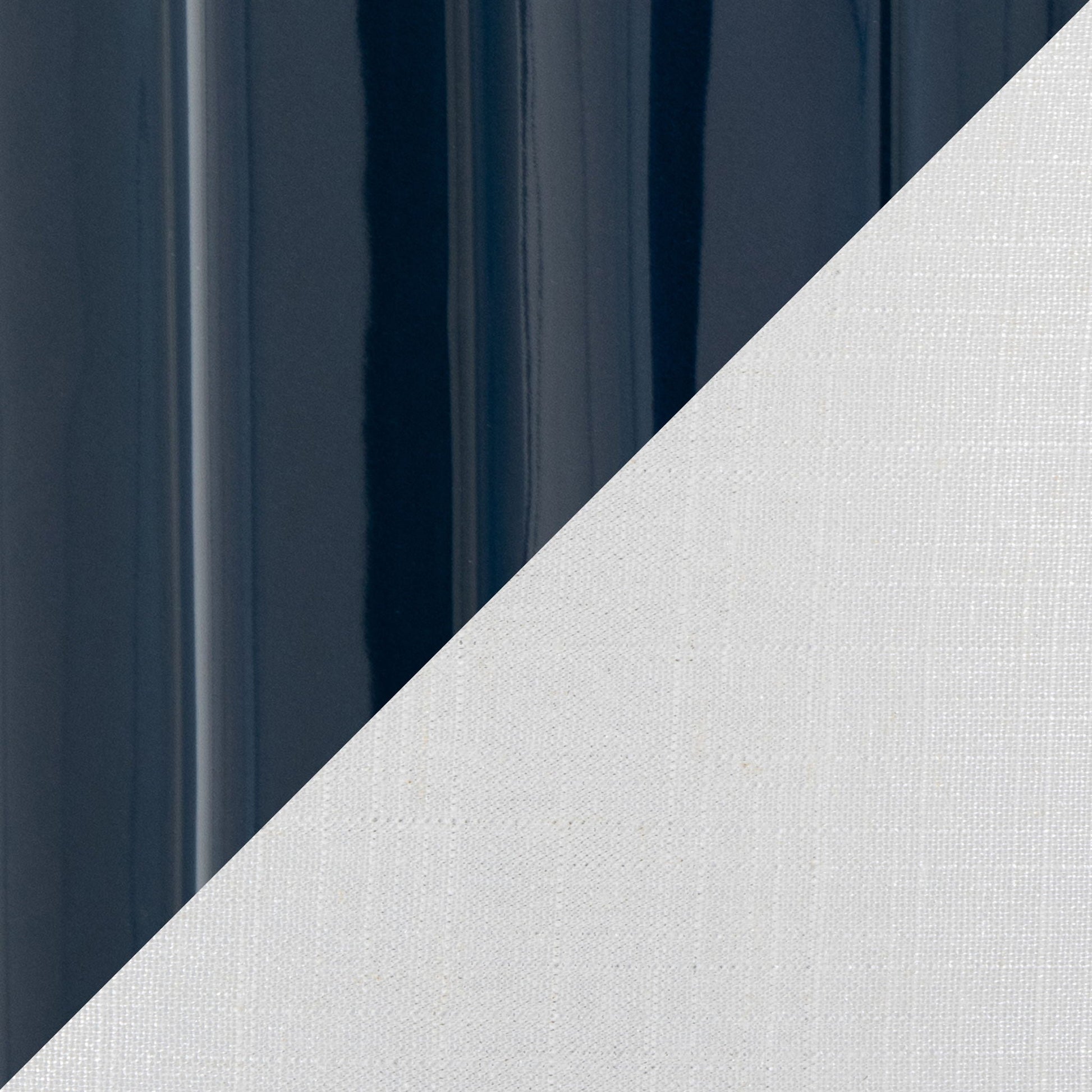 Stella table lamp navy finish with glossy surface on left; diagonal white textured backdrop on Tampa Home & Garden Store
