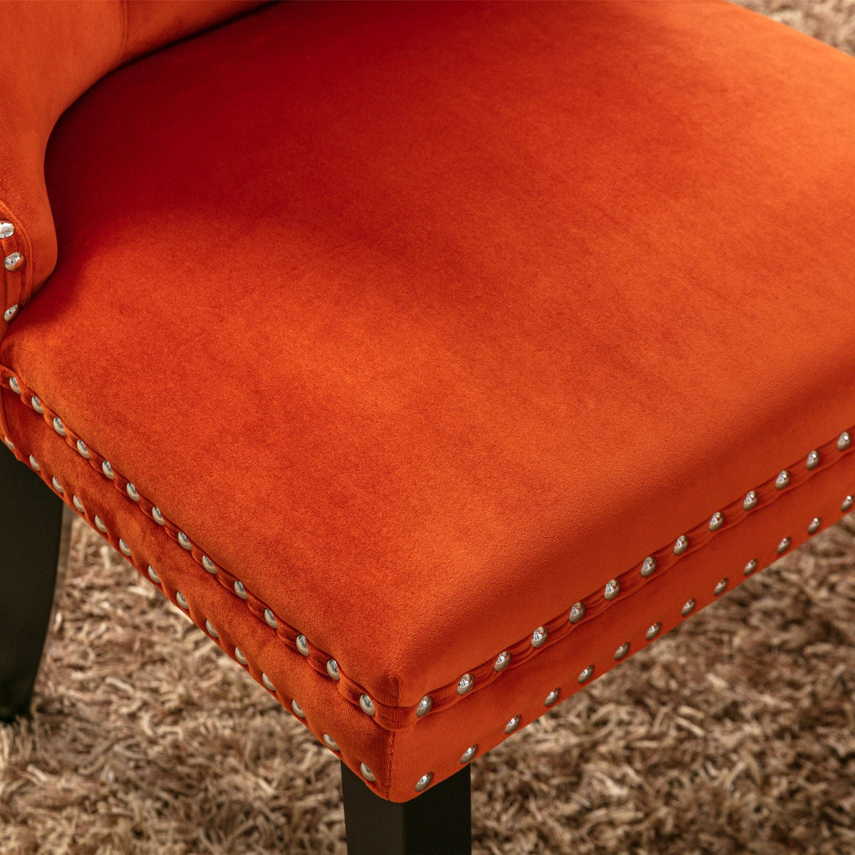 Tufted dining chair set in orange velvet by HouseOfZazla with nailhead trim and black legs on Tampa Home & Garden Store