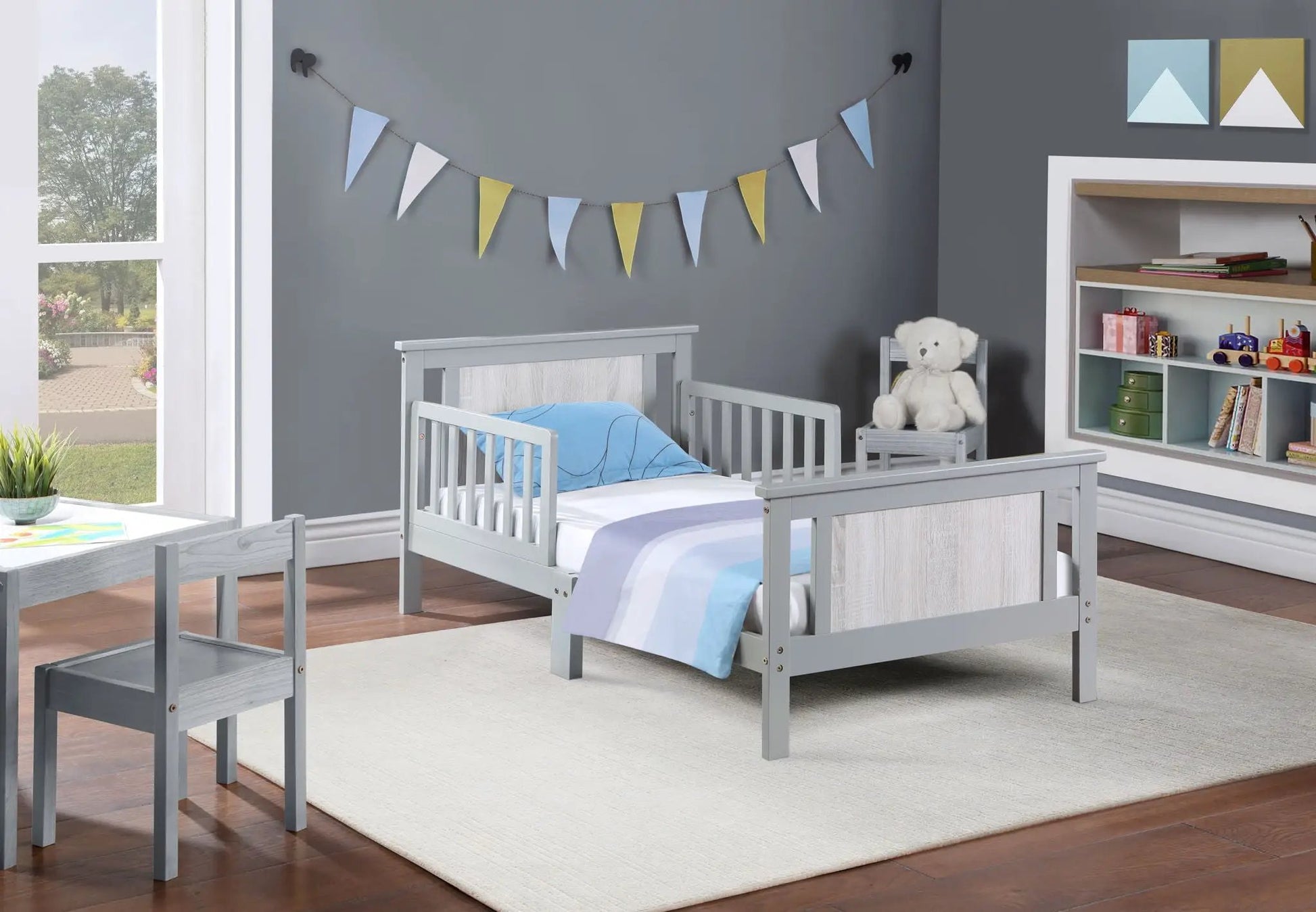 2 gray Connelly reversible panel toddler beds with blue bedding in a modern kids room on Tampa Home & Garden Store