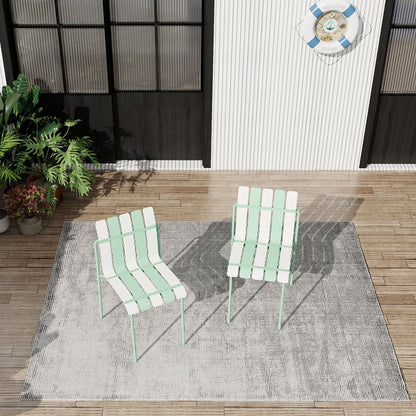 4-piece set of modern color-block kids chairs in mint and white for outdoor use on a wooden deck with a striped rug on Tampa Home & Garden Store