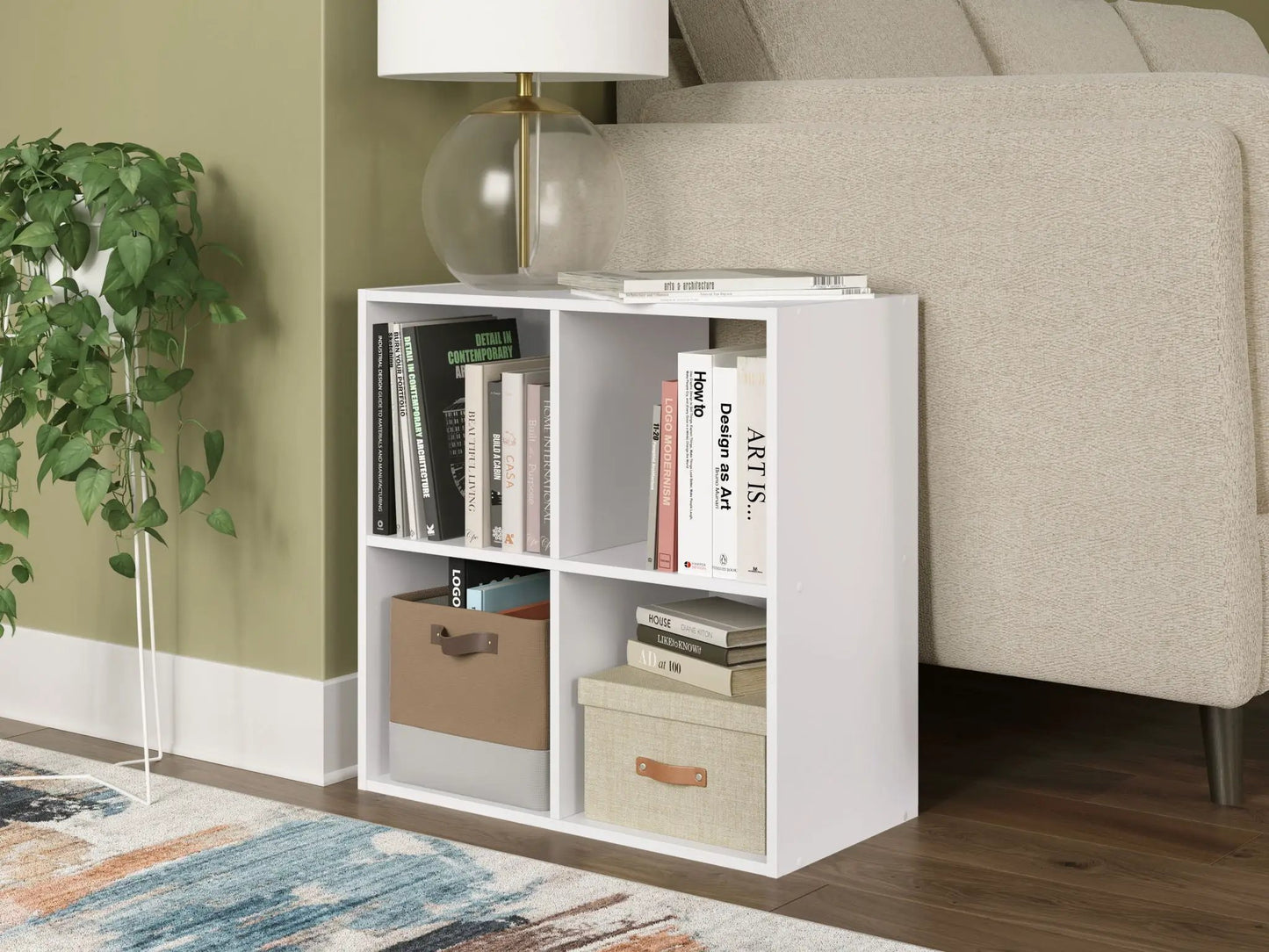 Onita white cube organizer with books and fabric bins, lamp and plant beside beige sofa on Tampa Home & Garden Store