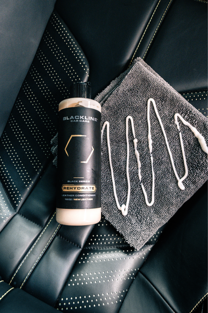 BLACKLINE Gentle APC cleaner bottle with black label beige liquid on car seat beside towel on Tampa Home & Garden Store