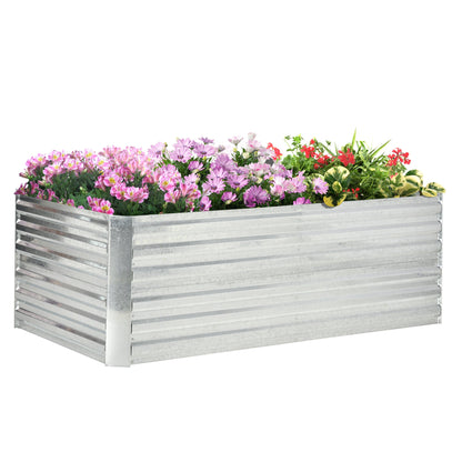 Galvanized raised garden bed filled with pink and purple flowers on Tampa Home & Garden Store
