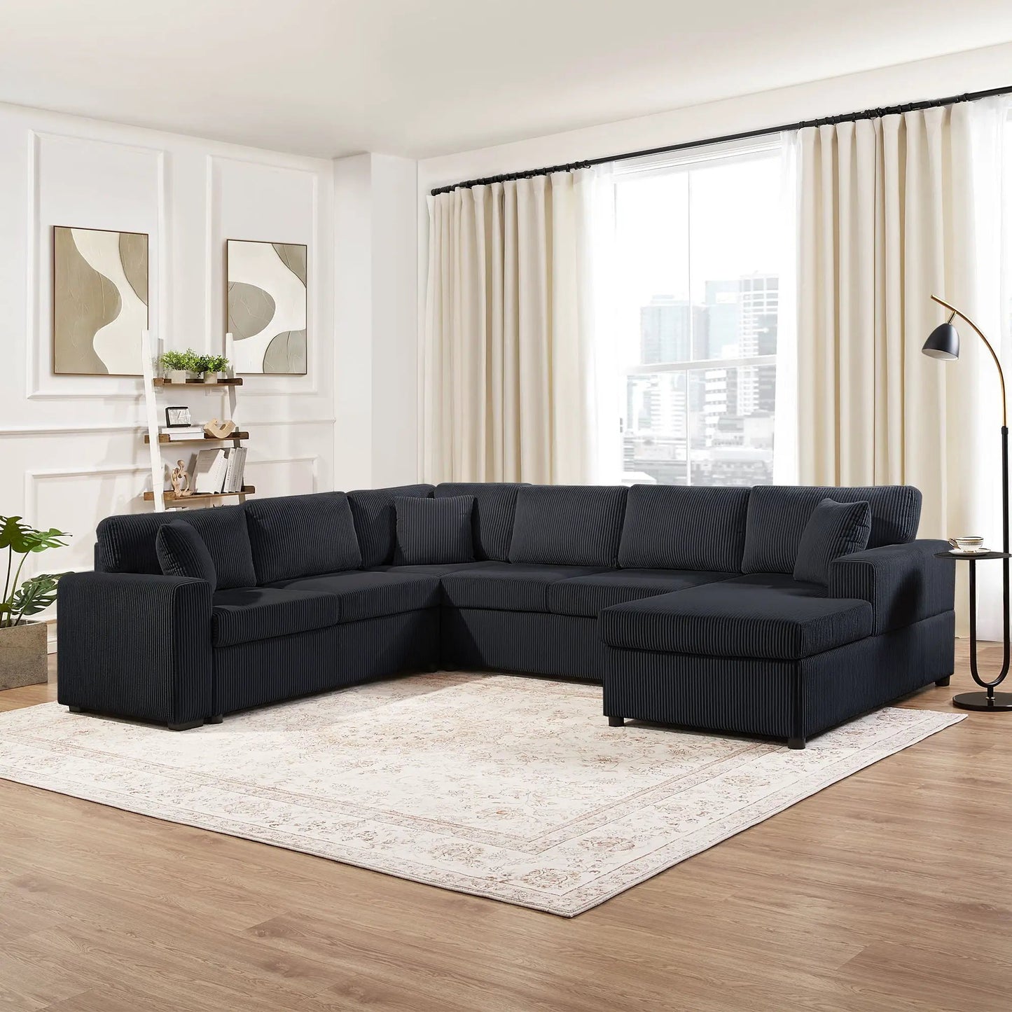 Oversized U-shaped sectional sofa with chaise lounge in dark navy fabric and three soft throw pillows on Tampa Home & Garden Store