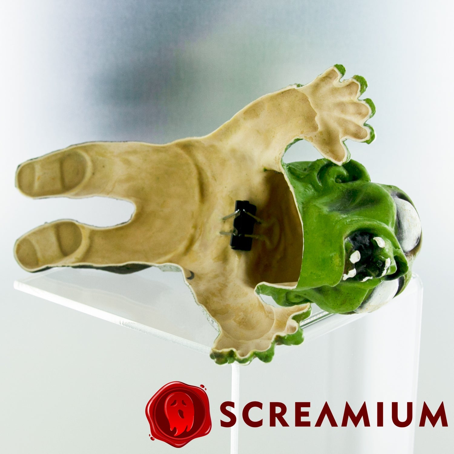 Shoulder Buddy Zombie costume accessory by SCREAMIUM; beige skeletal arm with green head on Tampa Home & Garden Store