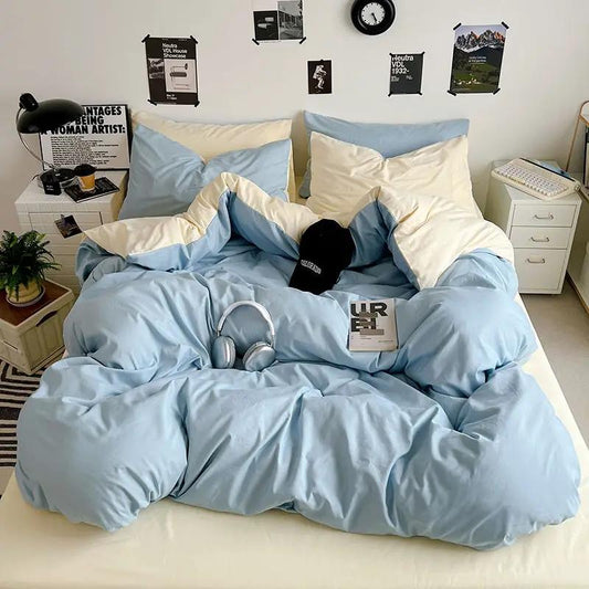 Washed cotton solid color four piece bedding set in light blue with ivory accents on Tampa Home & Garden Store