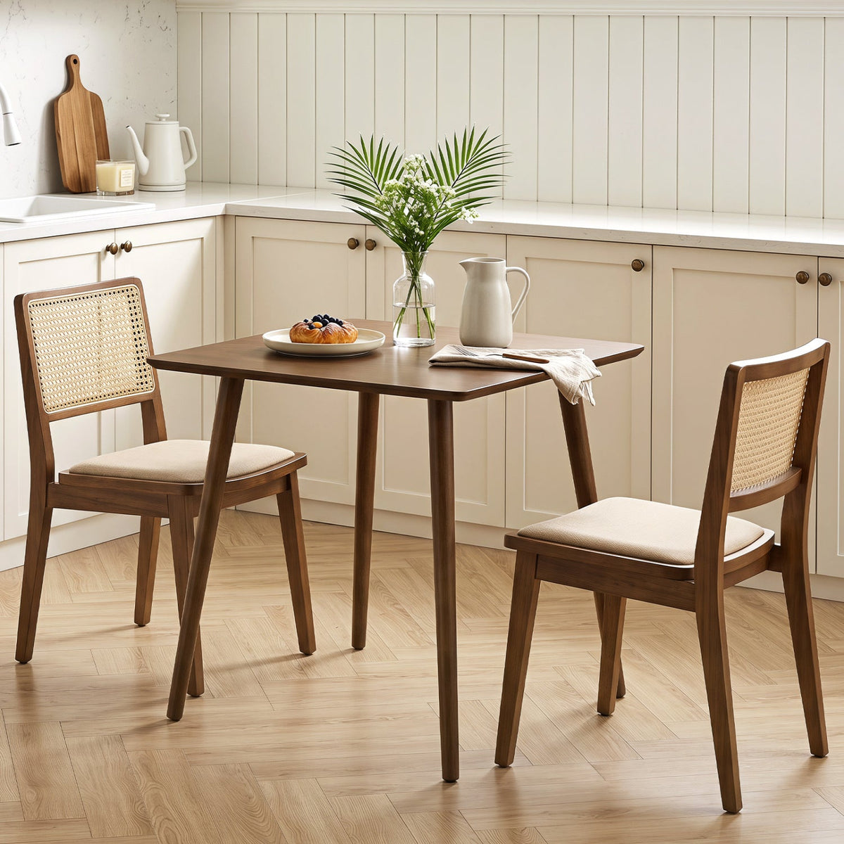 27.5in square walnut dining table for 2–4 with caned-back chairs in a white kitchen on Tampa Home & Garden Store