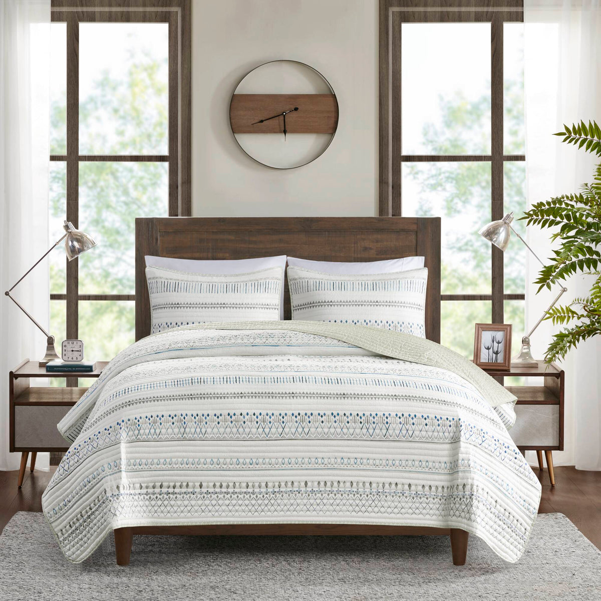 Printed Microfiber Seersucker Quilt Set reversible taupe/blue by HouseOfZazla on a bed on Tampa Home & Garden Store