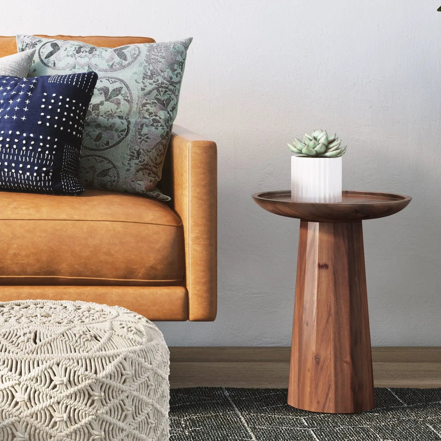Dayton handcrafted wooden accent side table with round top placed beside a tan leather sofa on Tampa Home & Garden Store