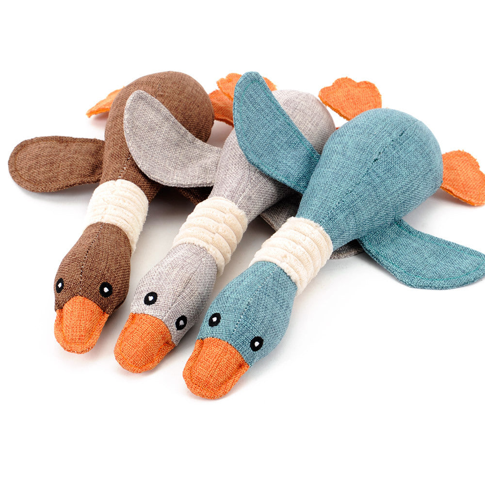 Three duck-shaped plush dog toys in brown, gray and blue with orange beaks and ribbed neckbands 3-pack on Tampa Home & Garden Store
