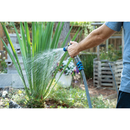 Orbit Elevated 100 Feet Heavy Duty Fabric Hose garden hose with blue nozzle in use on Tampa Home & Garden Store