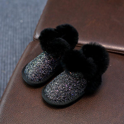 Toddler winter boots by Stevvex, glittery black upper with fluffy fur trim, pair on Tampa Home & Garden Store
