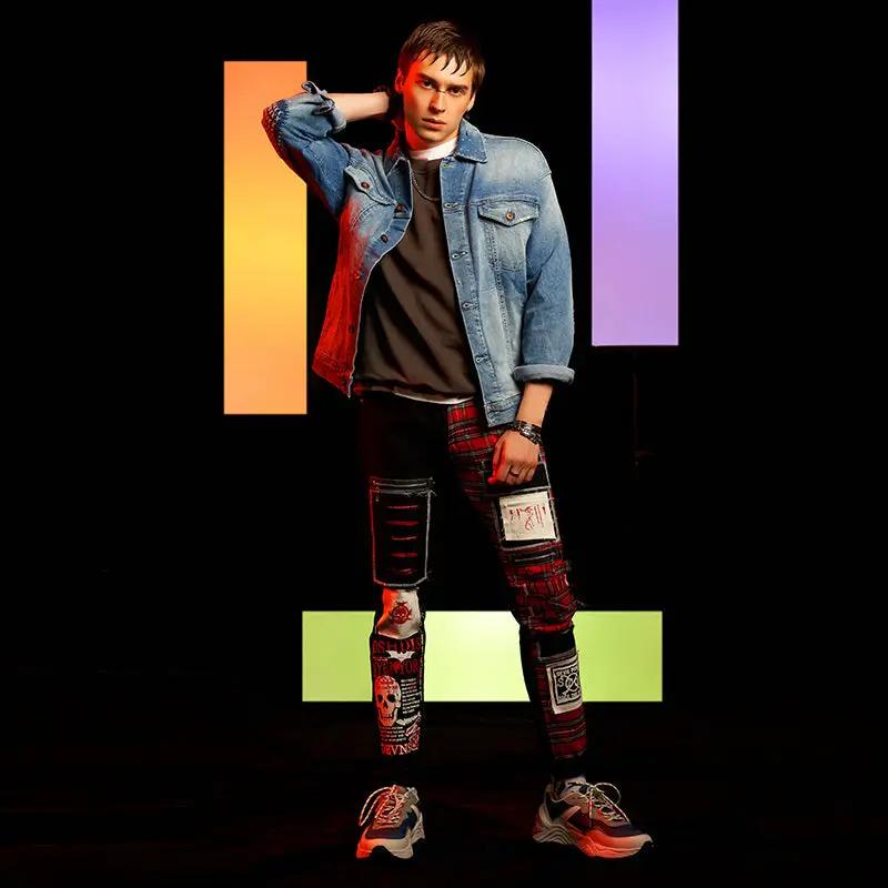 New men's ripped patch jeans with red plaid patches and black distressed panels on Tampa Home & Garden Store