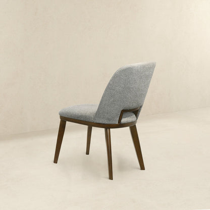 Modern dining chair with walnut base in gray fabric upholstery on Tampa Home & Garden Store