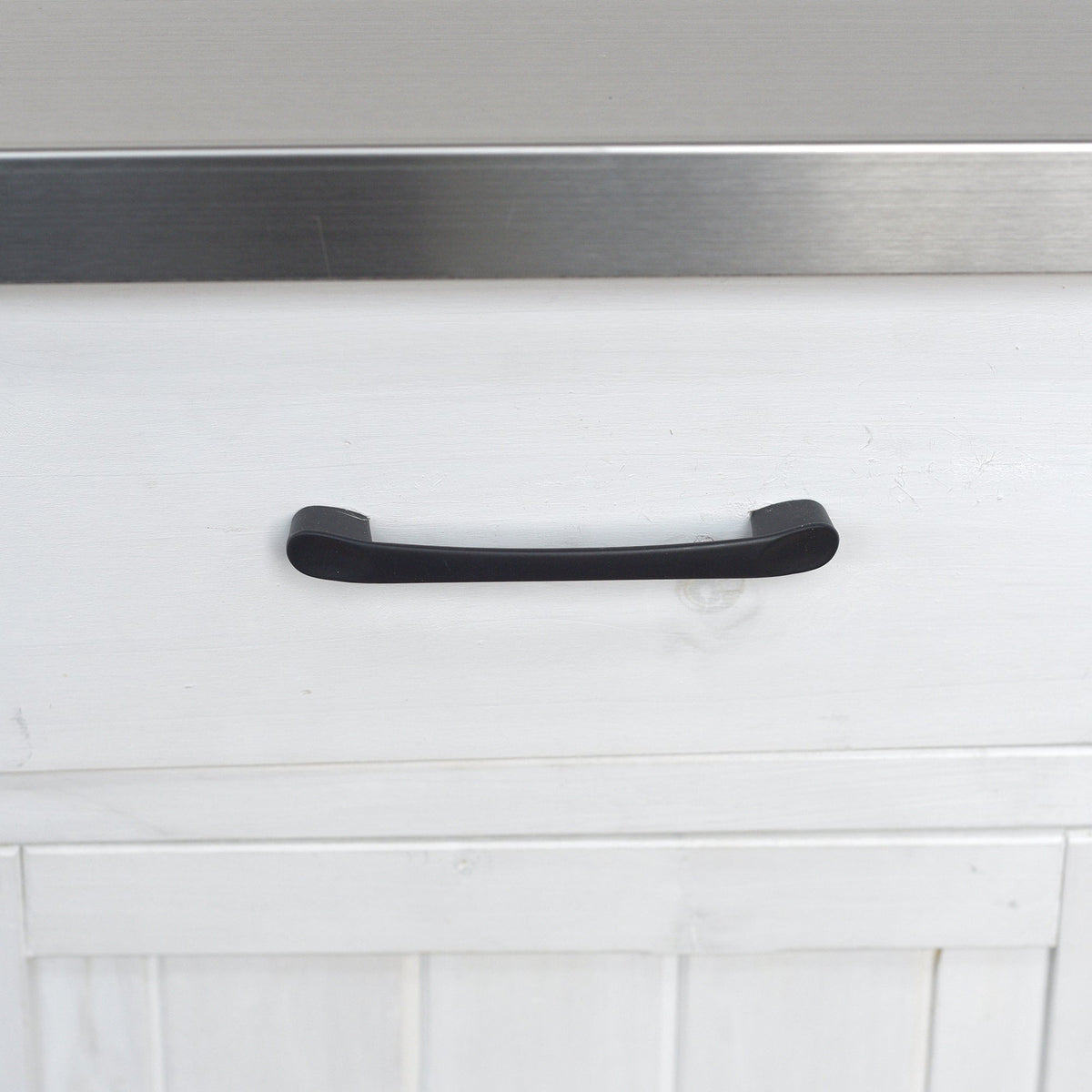 Outdoor kitchen island black curved handle on white painted cabinet panel on Tampa Home & Garden Store