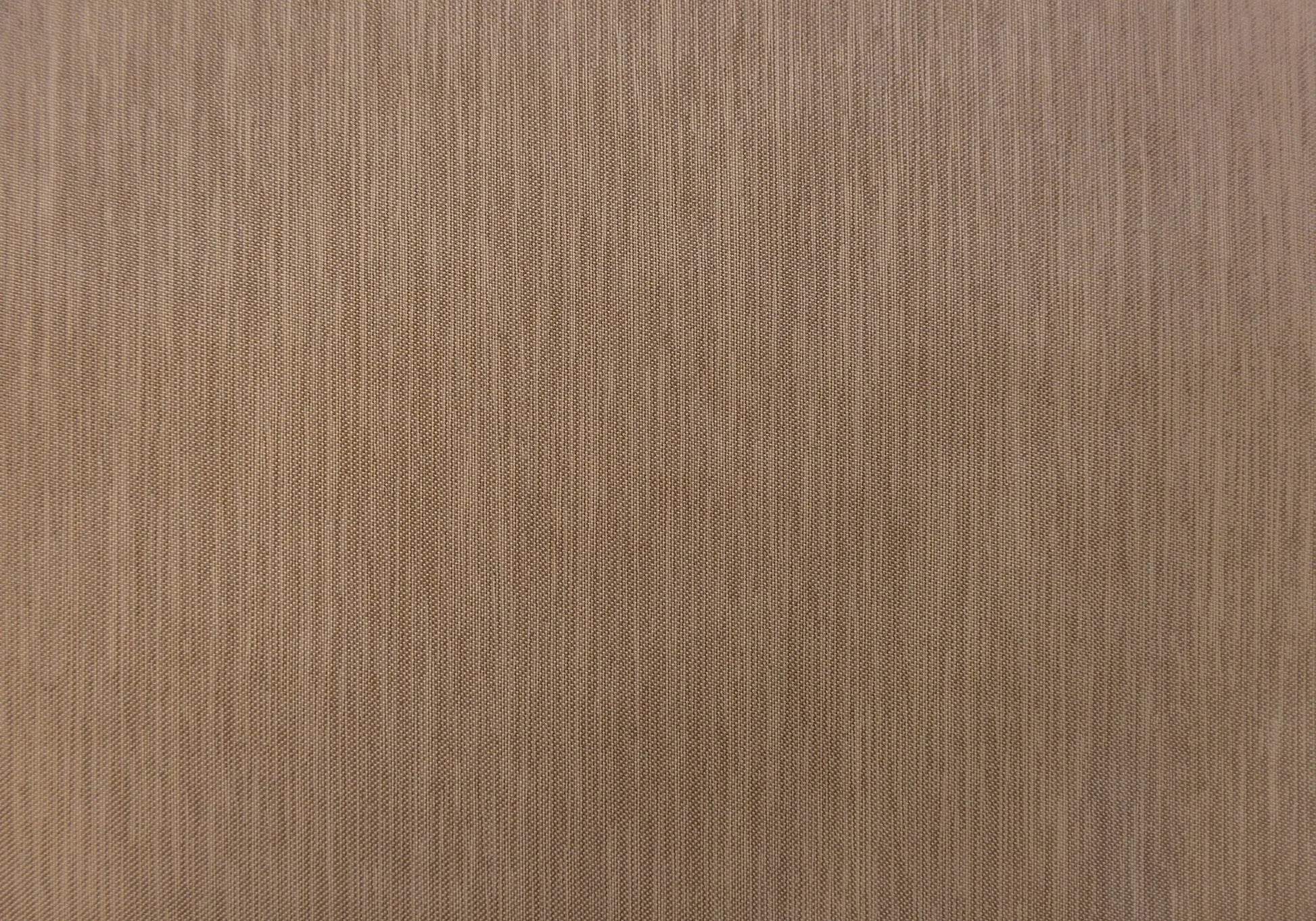 Curtain panel fabric close-up in brown with a woven texture on Tampa Home & Garden Store
