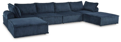 Bales sectional sofa in navy blue corduroy with ribbed upholstery and plush back cushions on Tampa Home & Garden Store