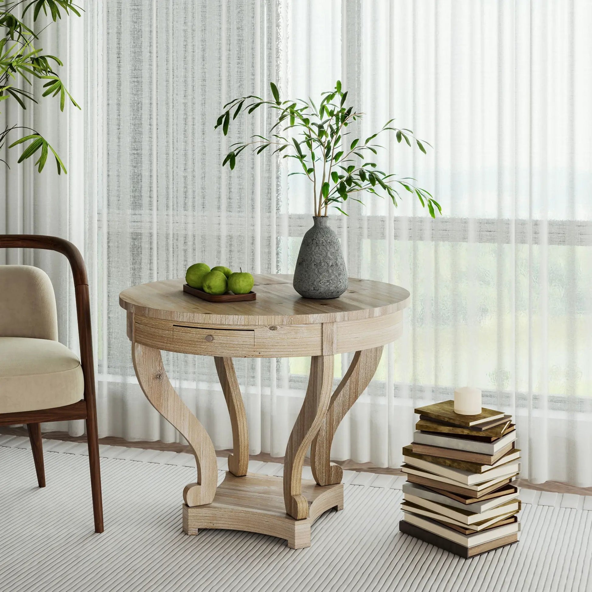 Small curved-leg farmhouse round side table in natural distressed wood with a plant vase on Tampa Home & Garden Store