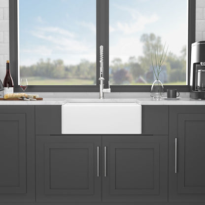 Farmhouse apron-front ceramic kitchen sink by HouseOfZazla in dark cabinets with spring faucet on Tampa Home & Garden Store
