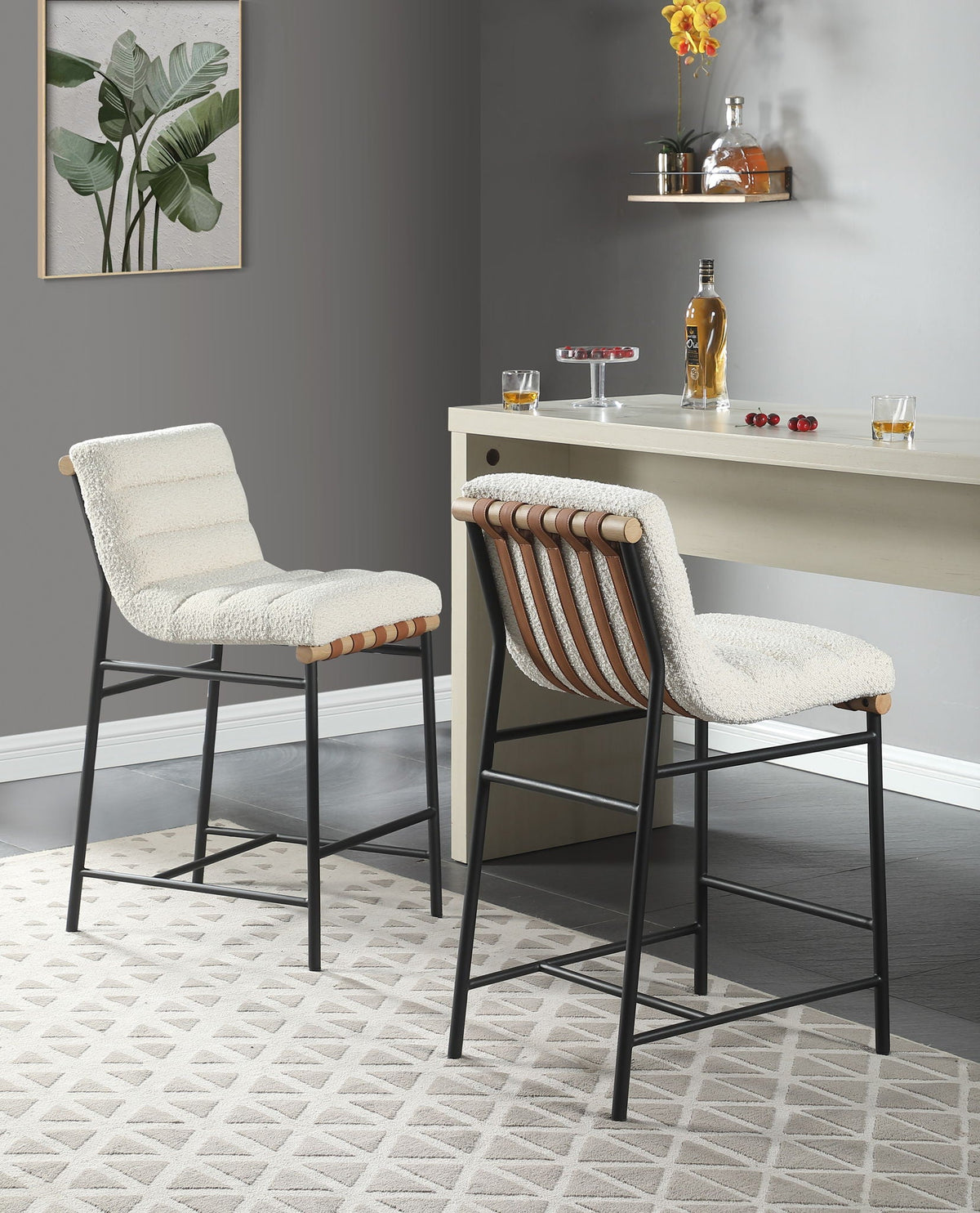 Pair of Lahni Boucle Counter Height Chairs in cream boucle with black legs at white counter on Tampa Home & Garden Store