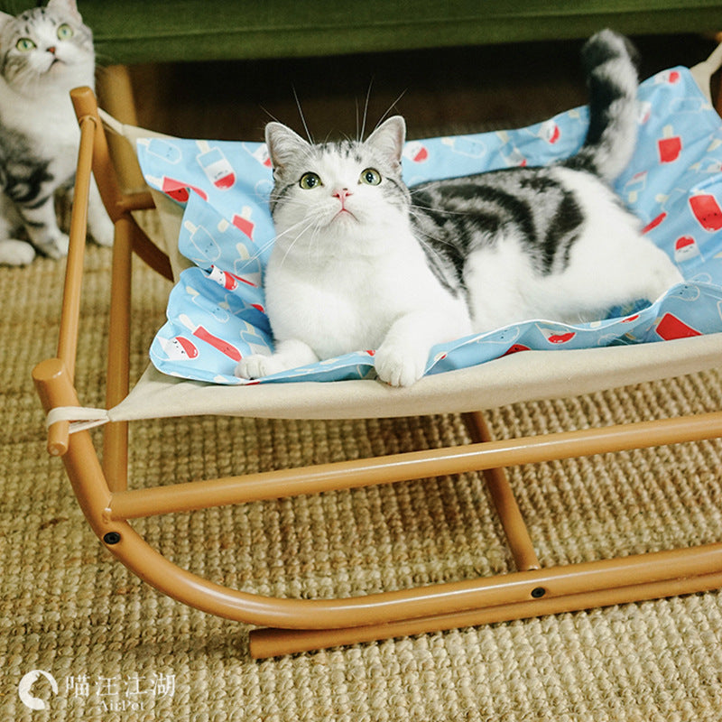 Iron Cat Hammock Pet Sofa Bed with beige frame and blue printed liner, cat lounging on it on Tampa Home & Garden Store