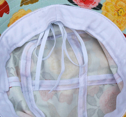 Cotton bucket sun hat by Womanswork with white interior ties and Heirloom Garden floral print on Tampa Home & Garden Store