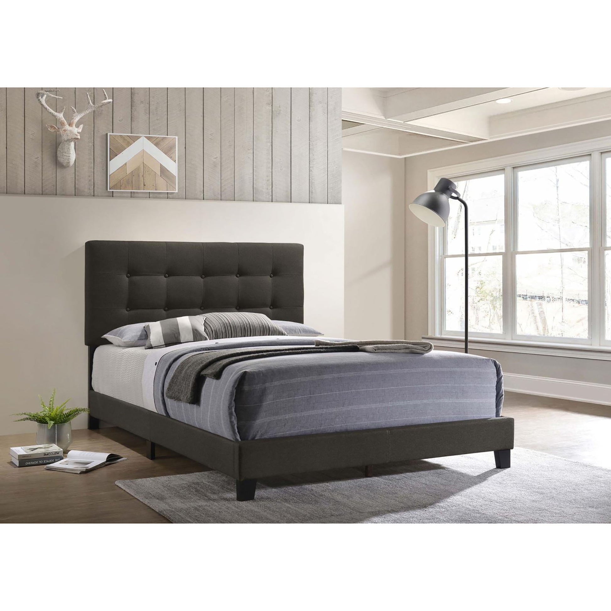 Tufted panel bed in charcoal gray upholstery with button tufted headboard and platform frame on Tampa Home & Garden Store