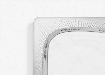 Bed Gear Dri-Tec crib mattress protector with gray trim on white surface on Tampa Home & Garden Store