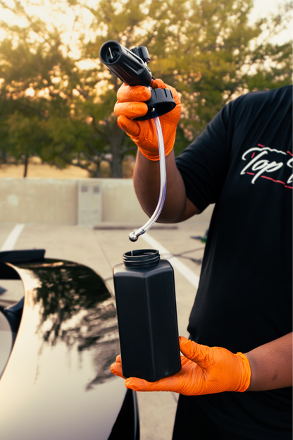 Blackline Foam Cannon Pro held in gloved hand with hose for car wash on Tampa Home & Garden Store
