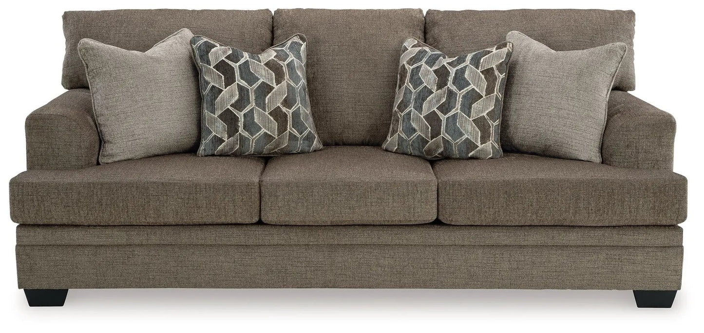 Stonemeade stationary sofa in taupe textured fabric with 2 geometric-pattern pillows on Tampa Home & Garden Store