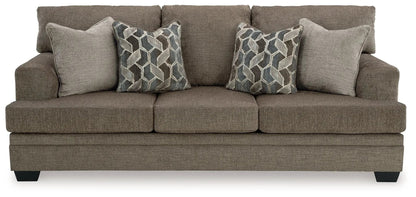 Stonemeade stationary sofa in taupe textured fabric with 2 geometric-pattern pillows on Tampa Home & Garden Store
