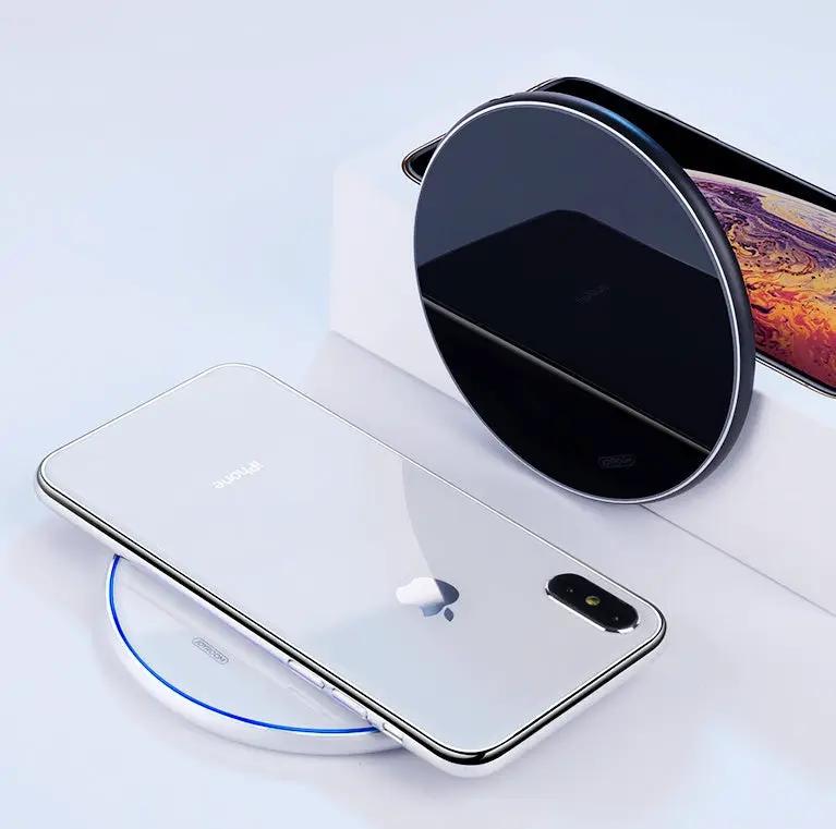 Wireless charger black round pad charging a white iPhone on fast charge on Tampa Home & Garden Store