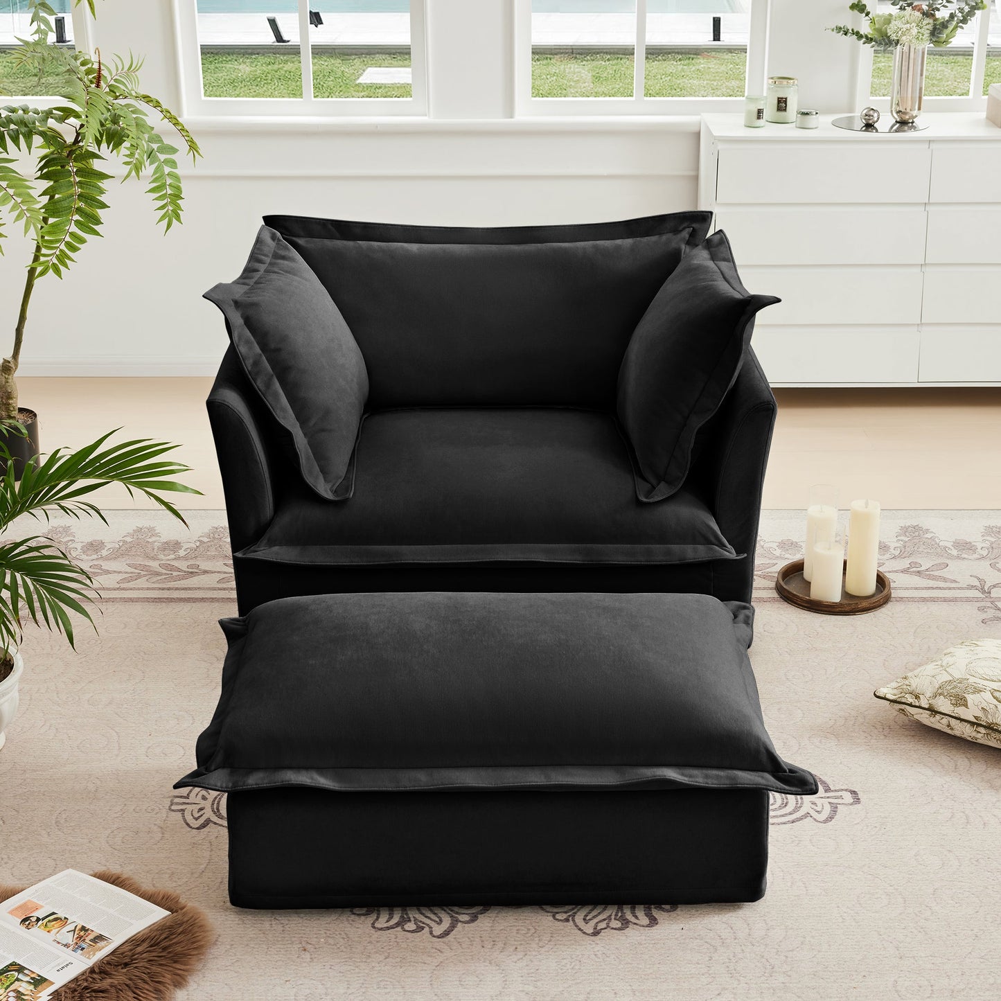 Upholstered slipcovered armchair and ottoman in black fabric, contemporary living room setup on Tampa Home & Garden Store