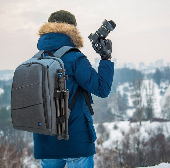 Camera backpack waterproof camera bag gray My Store; tripod attached, user holds a camera on Tampa Home & Garden Store