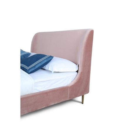 Heather upholstered bed with curved headboard in blush pink velvet on Tampa Home & Garden Store
