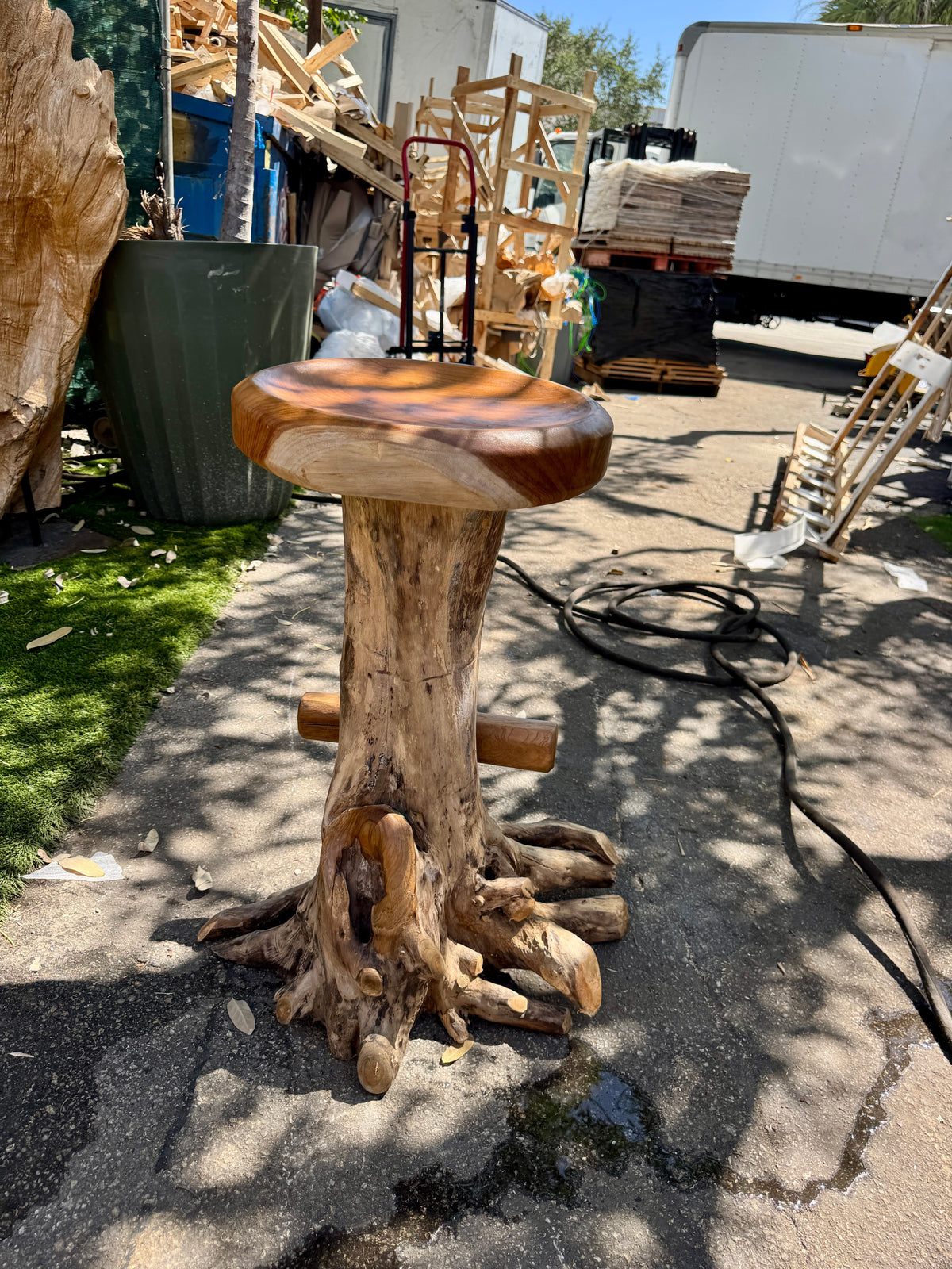 Teak Root Round Seat Barstool XL, natural wood finish on a carved trunk base on Tampa Home & Garden Store