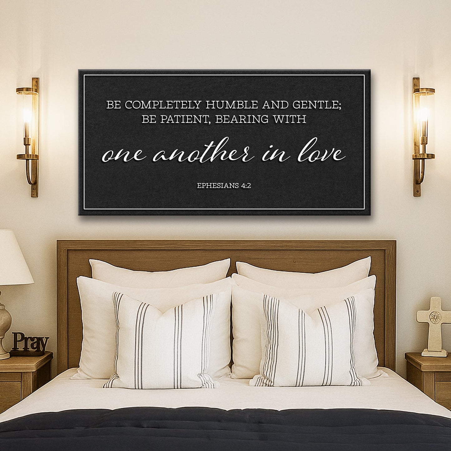 Be Completely Humble And Gentle Ephesians 4:2 Faith Sign II canvas with white text on black between gold sconces on Tampa Home & Garden Store