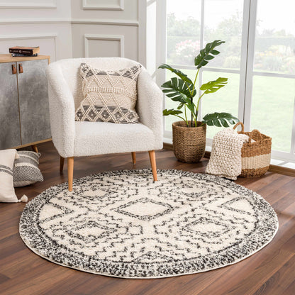 Buan Area Rug by Boutique Rugs, round cream shag with black geometric pattern on Tampa Home & Garden Store