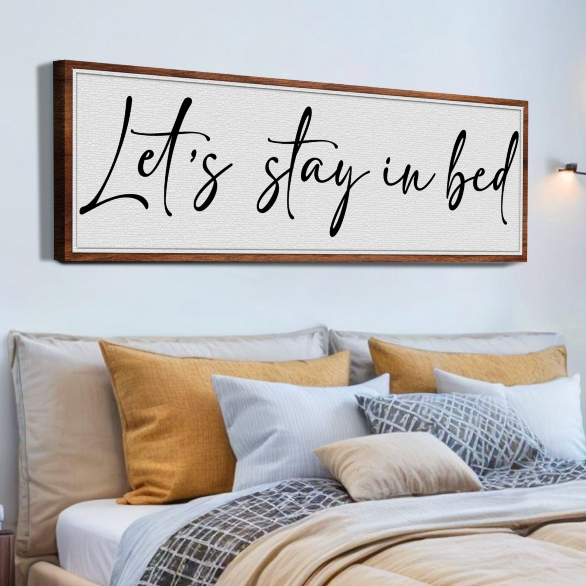 Let's Stay in Bed Bedroom Sign II canvas by Tailored Canvases, wood-framed wall art with black script on Tampa Home & Garden Store