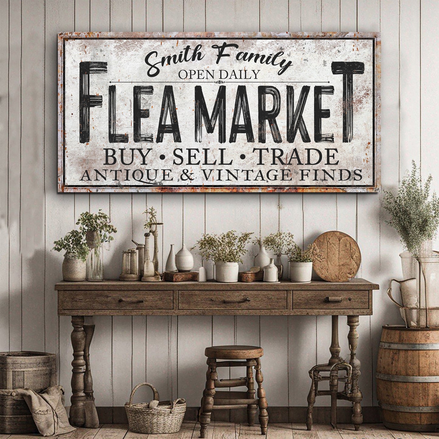 Family Flea Market sign canvas by Tailored Canvases, distressed white with bold FLEA MARKET lettering on Tampa Home & Garden Store