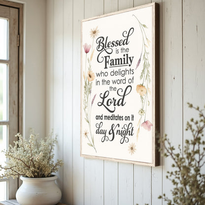 Blessed Is The Family faith sign canvas with light wood frame and floral border on a white wall on Tampa Home & Garden Store