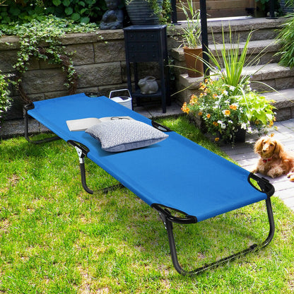 GemGear blue outdoor folding camping bed cot with pillow on lawn beside flowers and a dog on Tampa Home & Garden Store