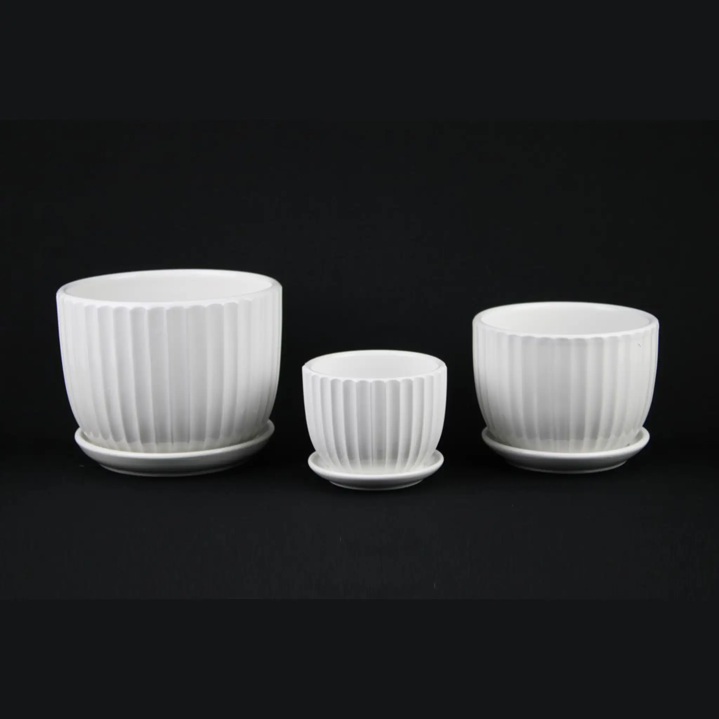 3-Piece white ceramic planter set with fluted texture and matching saucers Florinia on Tampa Home & Garden Store