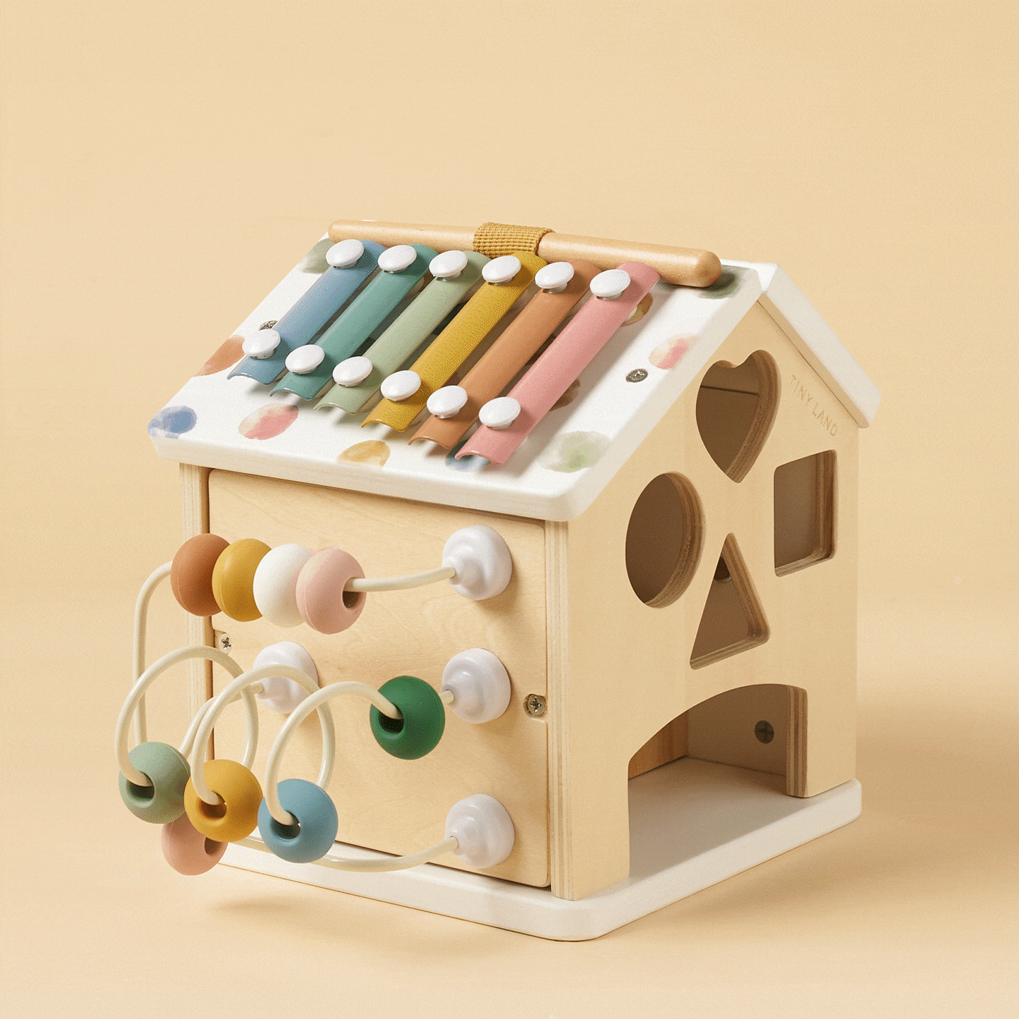 Tiny Land Cottage Activity Cube Morandi with pastel xylophone bars and bead maze on Tampa Home & Garden Store