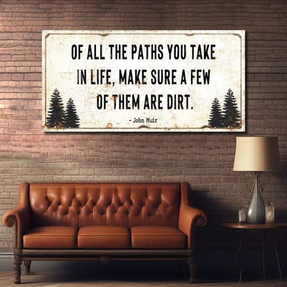 Canvas wall sign with distressed white panel and black quote about dirt paths, pine silhouettes on brick on Tampa Home & Garden Store