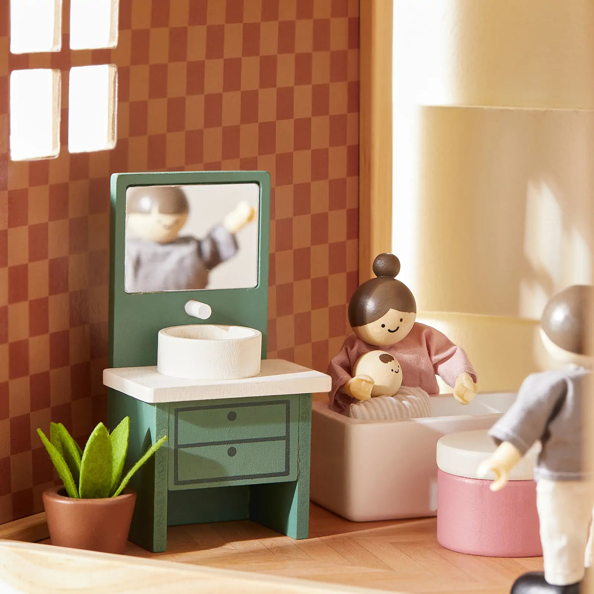Tiny Land Sweetwood Pegasus Dollhouse with green stove, checkered walls, and two wooden dolls on Tampa Home & Garden Store
