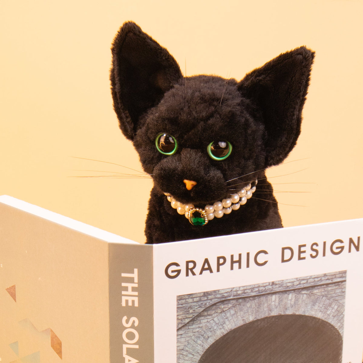 Devon Rex cat plush by Chongker, black fur with green eyes and pearl necklace pendant on Tampa Home & Garden Store