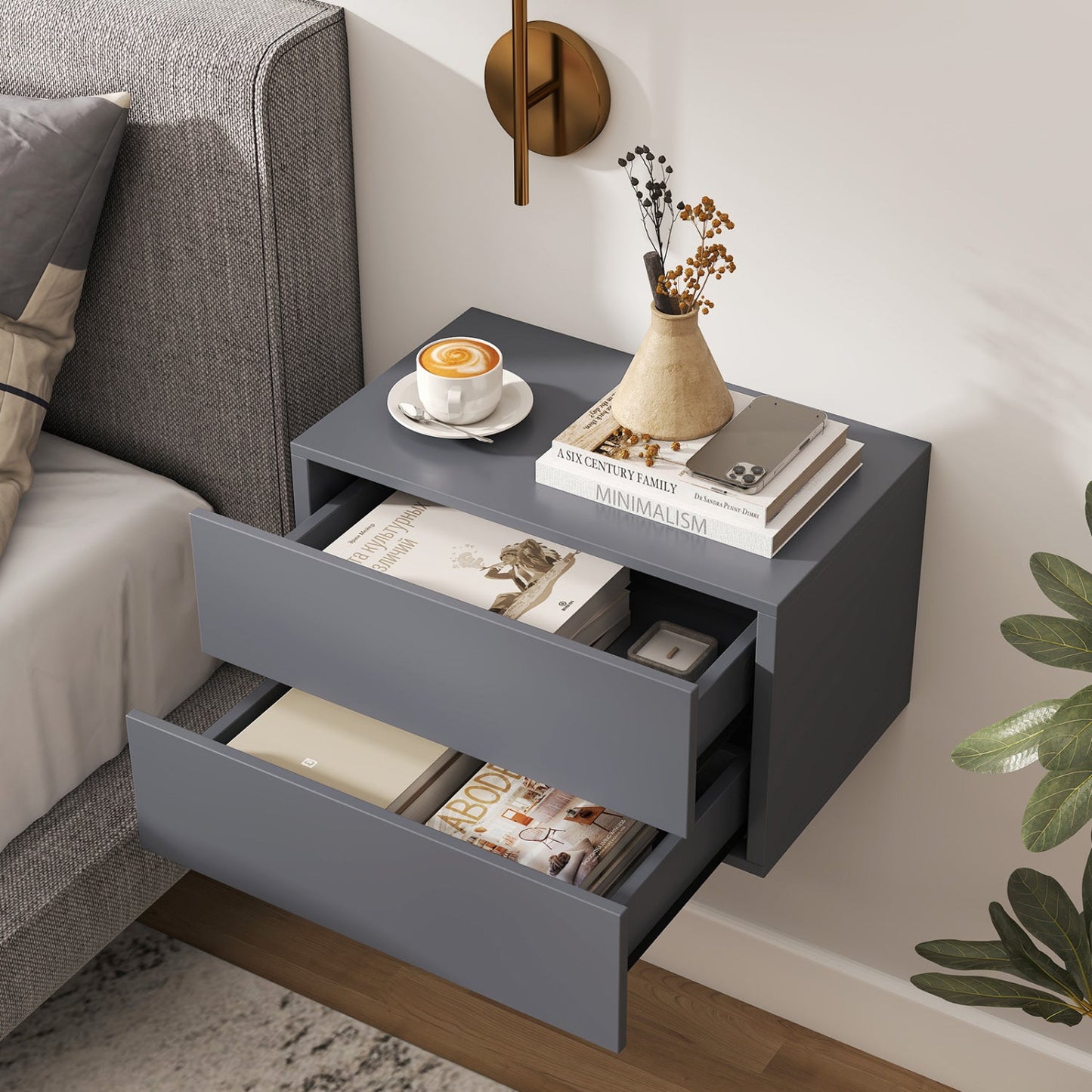 Wall mounted floating nightstand with 2 gray drawers, top with coffee cup, books, and vase on Tampa Home & Garden Store