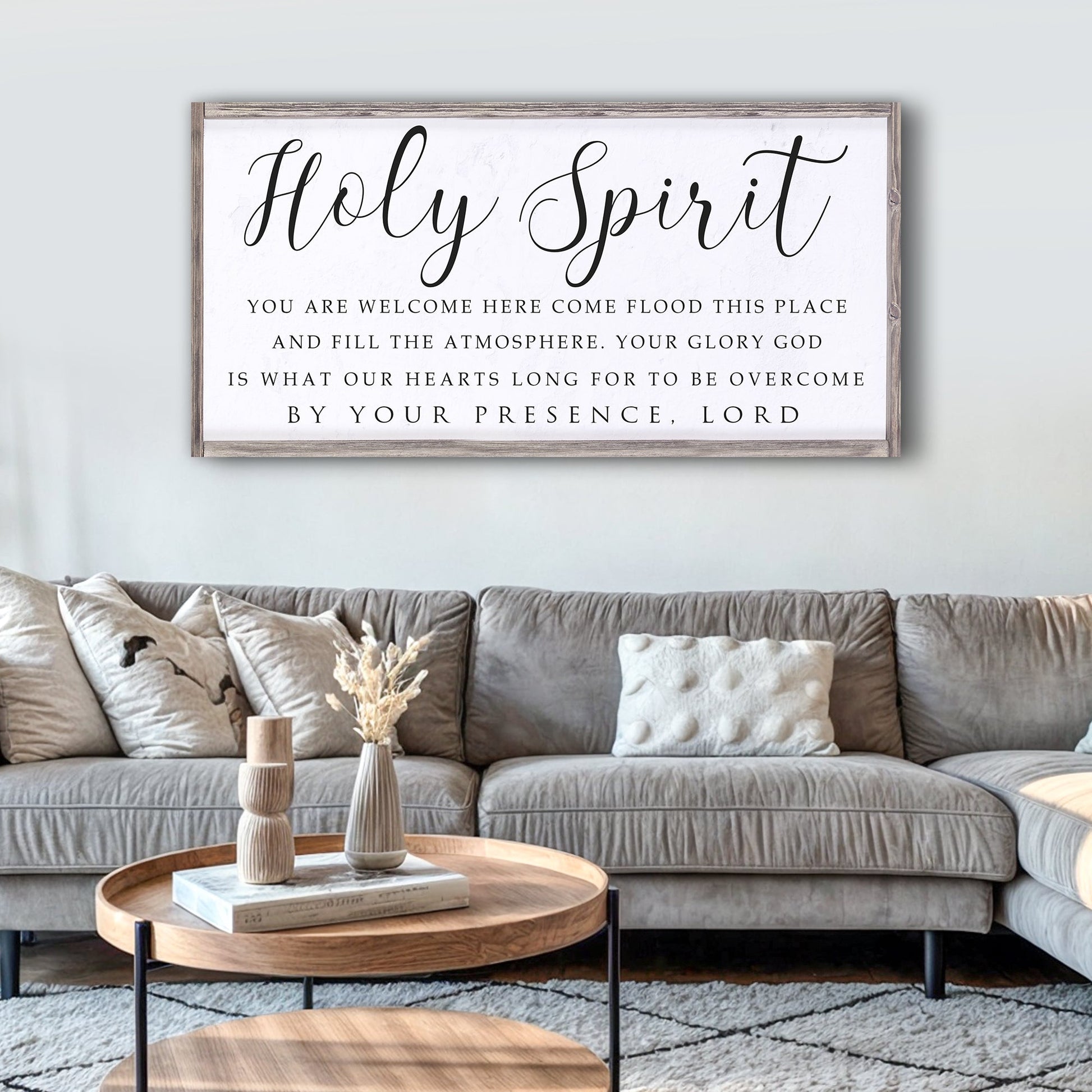 Canvas faith sign Holy Spirit in elegant cursive with rustic wood frame above sofa on Tampa Home & Garden Store