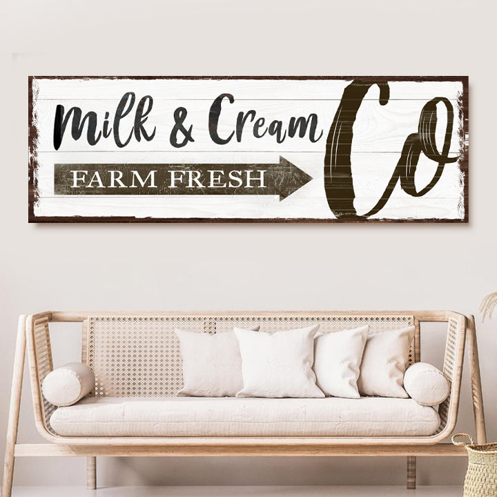 Canvas sign Farm Fresh Milk & Cream Co with distressed white wood panel and brown frame on Tampa Home & Garden Store